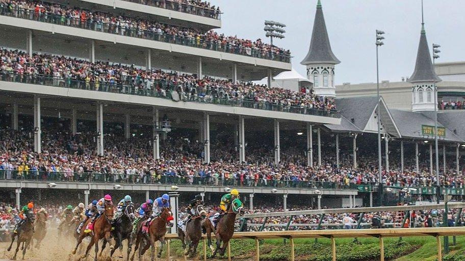 Horses round the turn at Churchill Downs