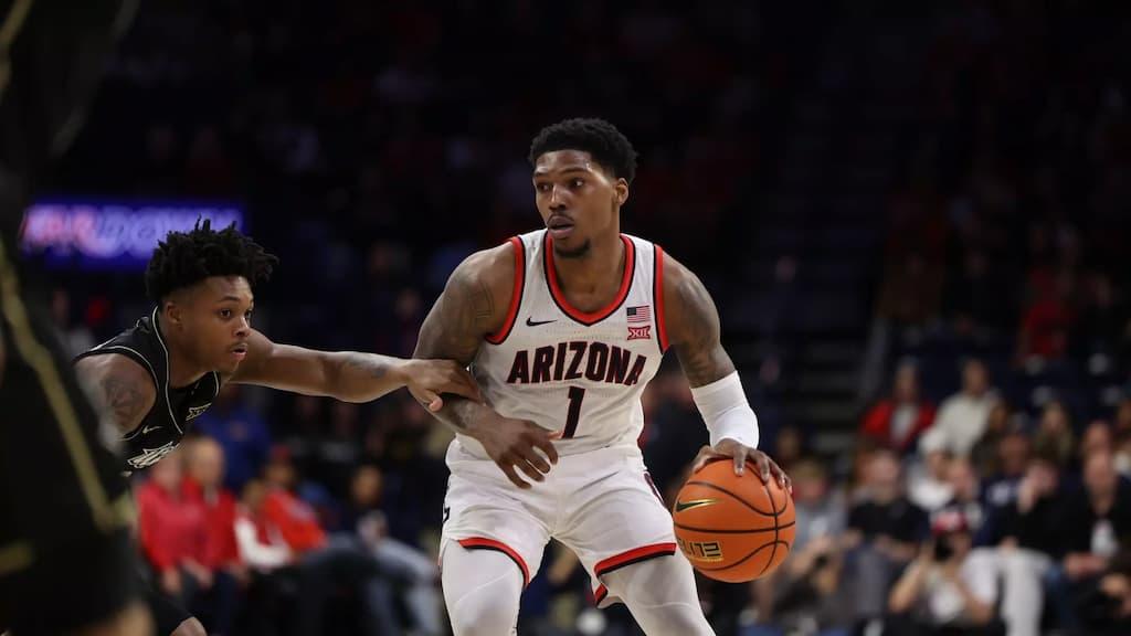 Caleb Love of the Arizona Wildcats dribbles the basketball.