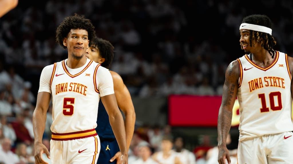 Iowa State men's basketball players Curtis Jones (#5 on the left) and Keshon Gilbert (#10 on the right) converse during a game