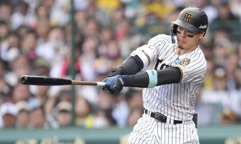 Hanshin Tigers baseball player Teruaki Sato takes a swing during a game - Niche Betting Markets & Prop Bets Guide cover