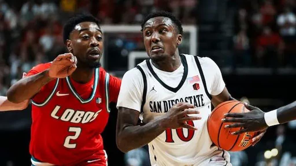 San Diego State's BJ Davis (right, #10), the hero vs. New Mexico - San Diego State vs. Utah State Prediction & Best Bets (2026 Mountain West Tournament Final - Saturday, March 14, 2026)