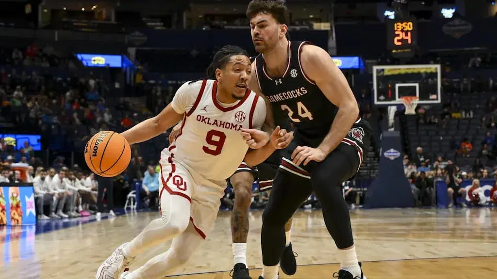 Oklahoma basketball star Nijel Pack (left, #9) in action - Oklahoma vs. Arkansas Basketball Prediction & Best Bets (2026 SEC Tournament Quarterfinals - Friday, March 13, 2026) cover