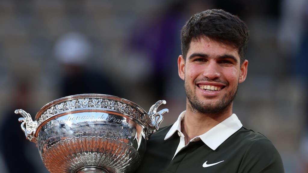 French Open Betting Guide cover (Carlos Alcaraz holding the winner's trophy after winning the 2025 French Open men's singles final)