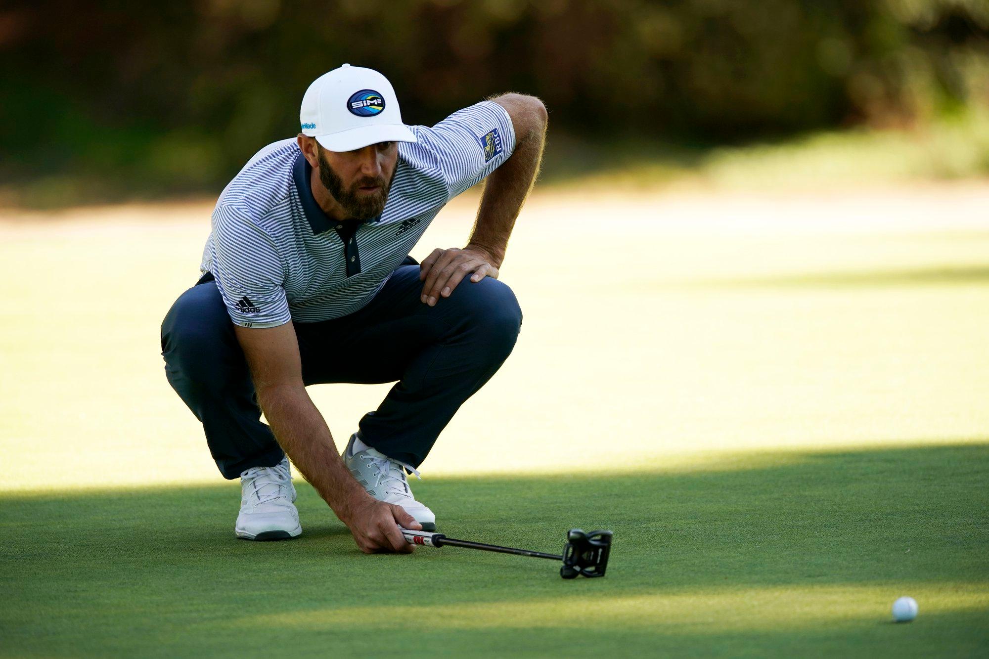 Dustin Johnson lines up his putt on the 13th hole during the final round of the Genesis Invitational golf tournament at Riviera Country Club, Sunday, Feb. 21, 2021, in the Pacific Palisades area of Los Angeles. (AP Photo/Ryan Kang)
