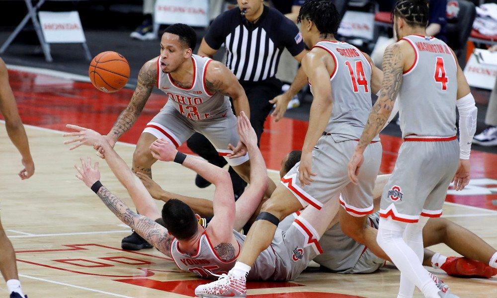 Feb 21, 2021; Columbus, Ohio, USA; Ohio State Buckeyes guard CJ Walker (13) fights for the loose ball during the second half against the Michigan Wolverines at Value City Arena. Mandatory Credit: Joseph Maiorana-USA TODAY Sports