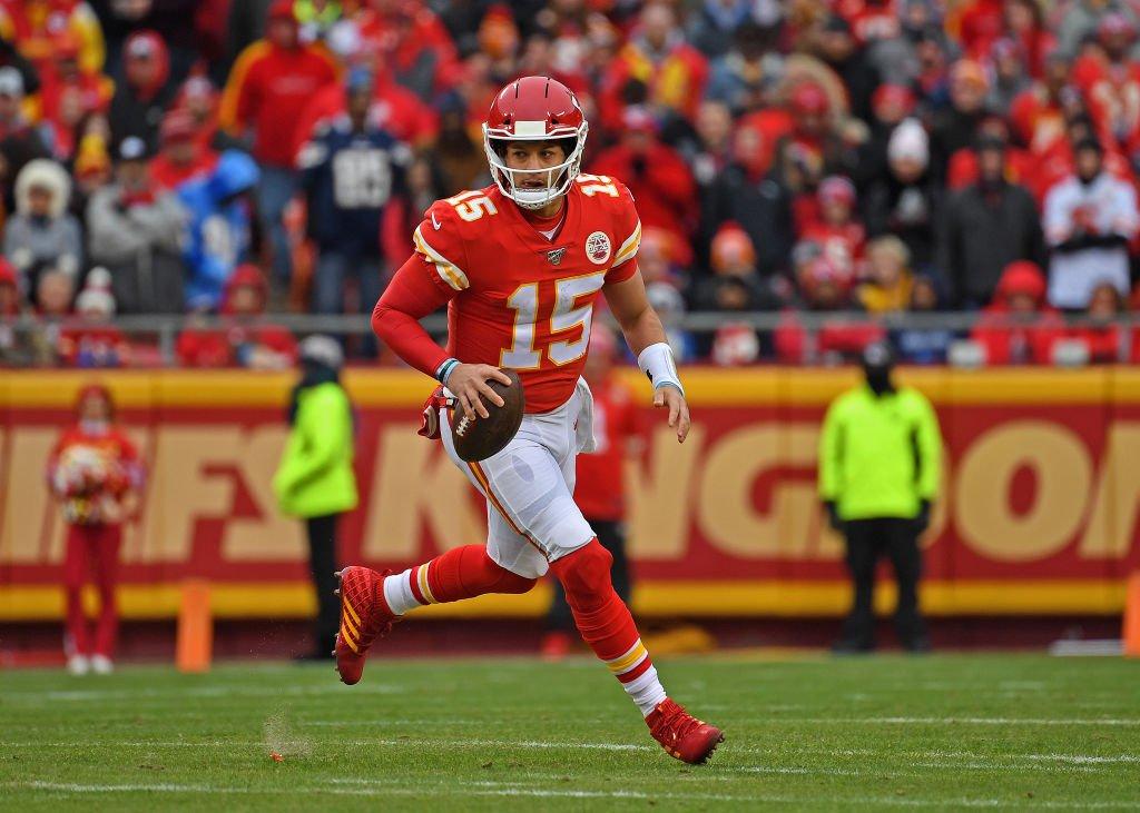 KANSAS CITY, MO - DECEMBER 29:  Quarterback Patrick Mahomes #15 of the Kansas City Chiefs rolls out against the Los Angeles Chargers during the first half at Arrowhead Stadium on December 29, 2019 in Kansas City, Missouri. (Photo by Peter G. Aiken/Getty Images)