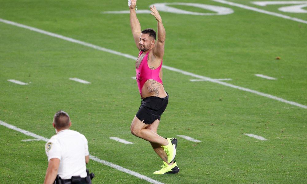 Feb 7, 2020; Tampa, FL, USA; Security personnel chase a fan who ran on to the field during the fourth quarter of Super Bowl LV between the Kansas City Chiefs and the Tampa Bay Buccaneers at Raymond James Stadium. Mandatory Credit: Kim Klement-USA TODAY Sports ORG XMIT: IMAGN-444308 ORIG FILE ID: 20210207_gma_sv7_261.jpg