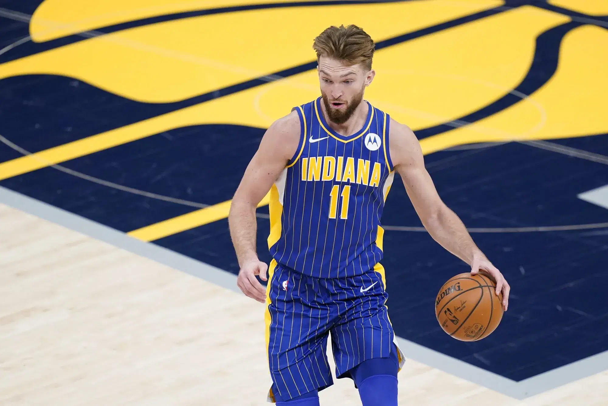 Indiana Pacers forward Domantas Sabonis (11) dribbles during the first half of an NBA basketball game against the Denver Nuggets, Thursday, March 4, 2021, in Indianapolis. (AP Photo/Darron Cummings)