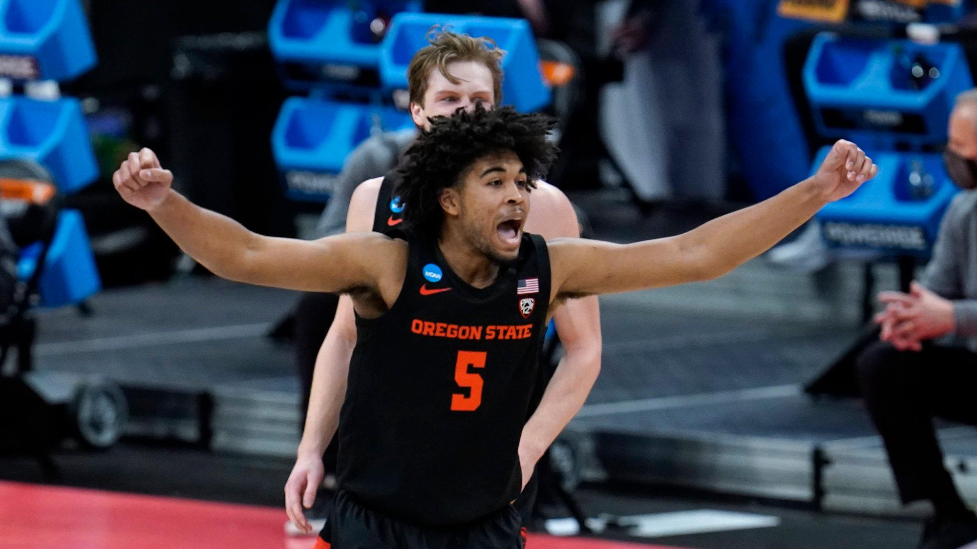Oregon State guard Ethan Thompson (5) reacts to a basket against Tennessee during the second half of a men's college basketball game in the first round of the NCAA tournament at Bankers Life Fieldhouse in Indianapolis, Friday, March 19, 2021. (AP Photo/Paul Sancya)