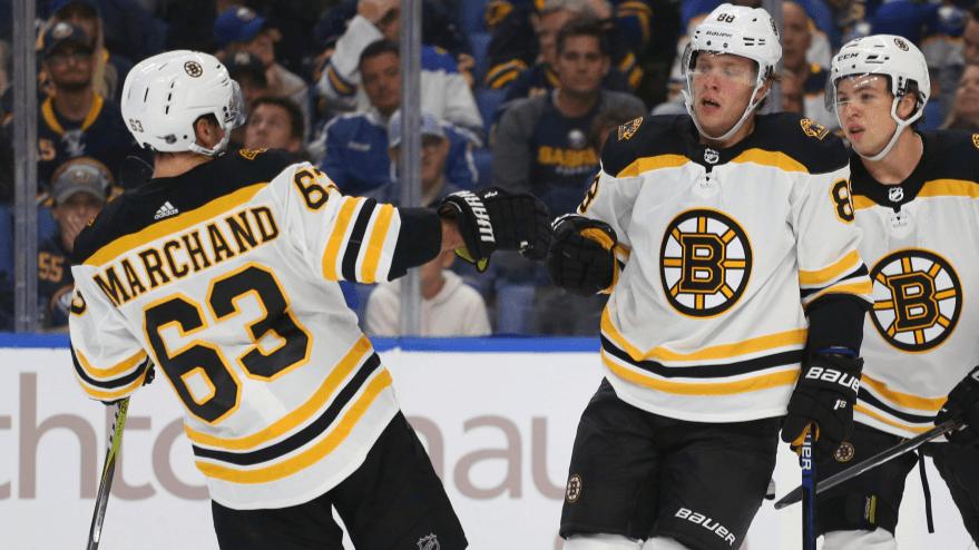 Boston Bruins forwards Brad Marchand (63) and David Pastrnak (88) celebrate a goal during the second period of the team's NHL hockey game against the Buffalo Sabres, Thursday, Oct. 4, 2018, in Buffalo N.Y. (AP Photo/Jeffrey T. Barnes)