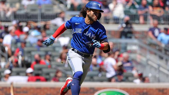 ATLANTA, GEORGIA - MAY 13:  Bo Bichette #11 of the Toronto Blue Jays runs down the first base line after hitting a two-RBI double in the ninth inning against the Atlanta Braves at Truist Park on May 13, 2021 in Atlanta, Georgia. (Photo by Kevin C. Cox/Getty Images)