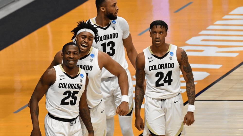 Mar 20, 2021; Indianapolis, Indiana, USA;  Colorado Buffaloes guard McKinley Wright IV (25) celebrates with forward Evan Battey (21) after making a basket against the Georgetown Hoyas during the first round of the 2021 NCAA Tournament at Hinkle Fieldhouse. Mandatory Credit: Patrick Gorski-USA TODAY Sports