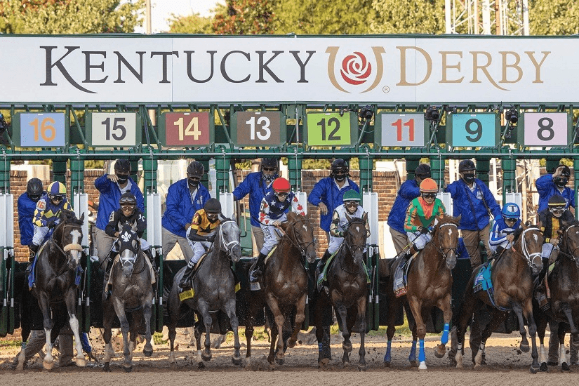 Horses break from the gate in the Kentucky Derby