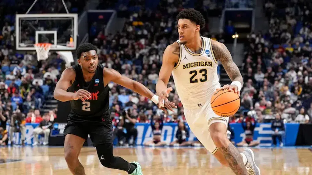 Michigan basketball star Yaxel Lendeborg (pictured right, #23) - #9 Saint Louis vs. #1 Michigan Prediction & Picks (2026 NCAA Tournament Midwest Second Round) cover