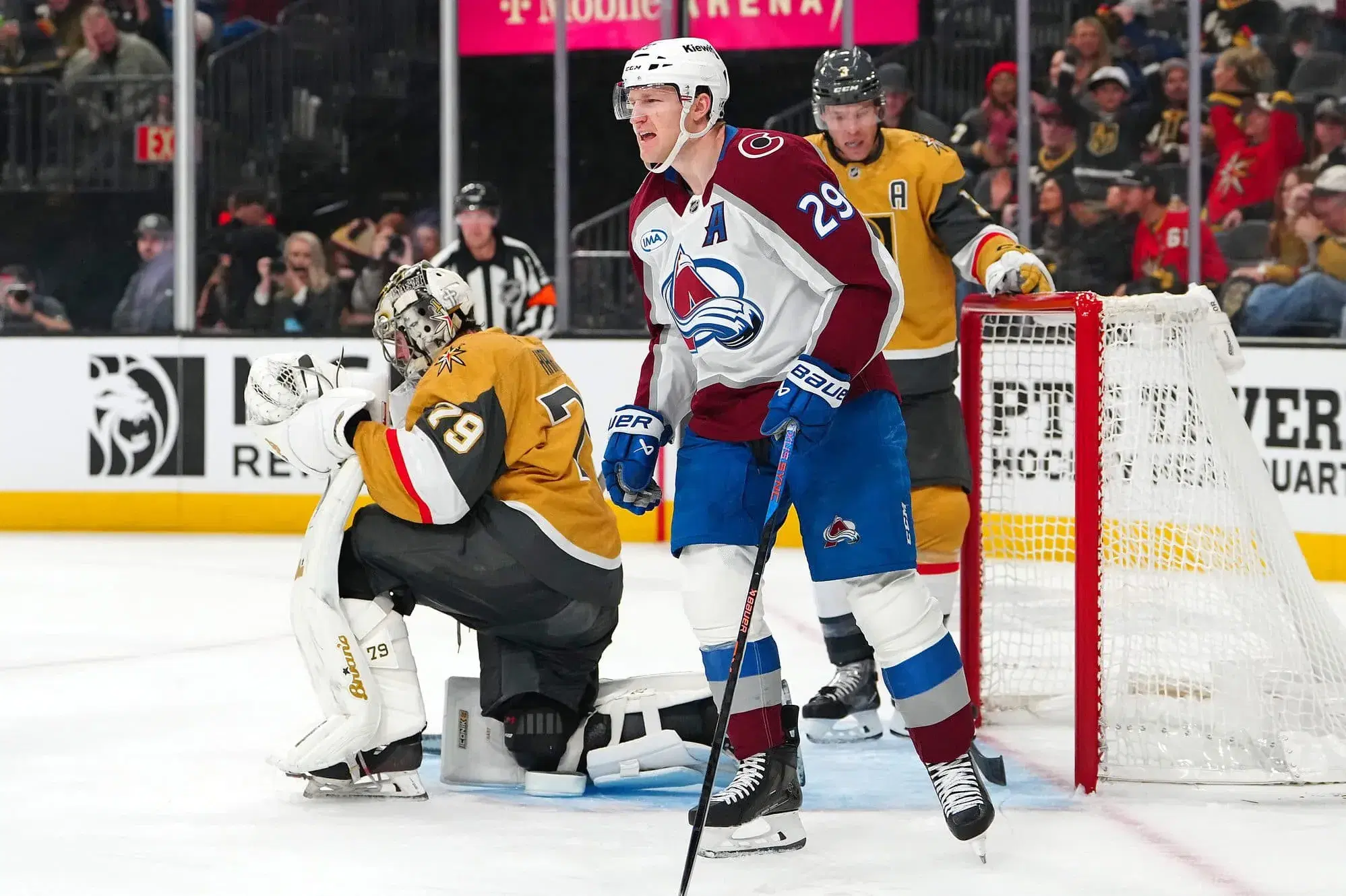 Nathan MacKinnon and Carter Hart