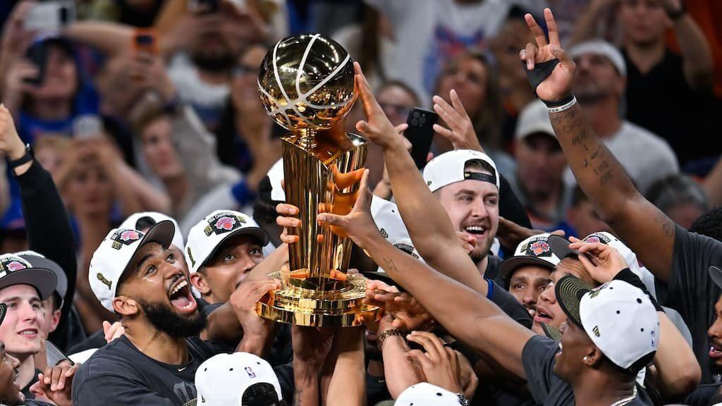 NBA Finals Betting Guide cover (New York Knicks celebrate winning the 2026 NBA Finals)
