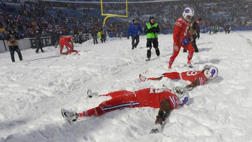 How Weather Impacts Sports Betting Guide cover (snow at an NFL game)