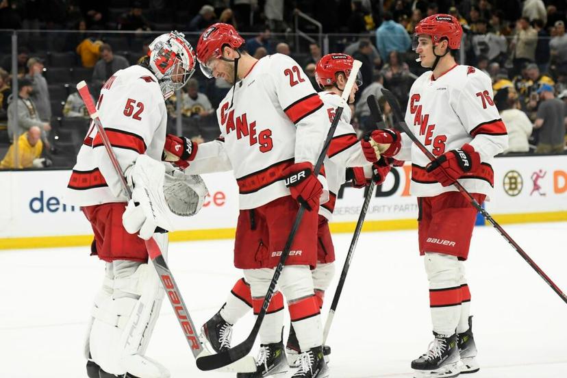 Carolina Hurricanes teammates celebrating a big win