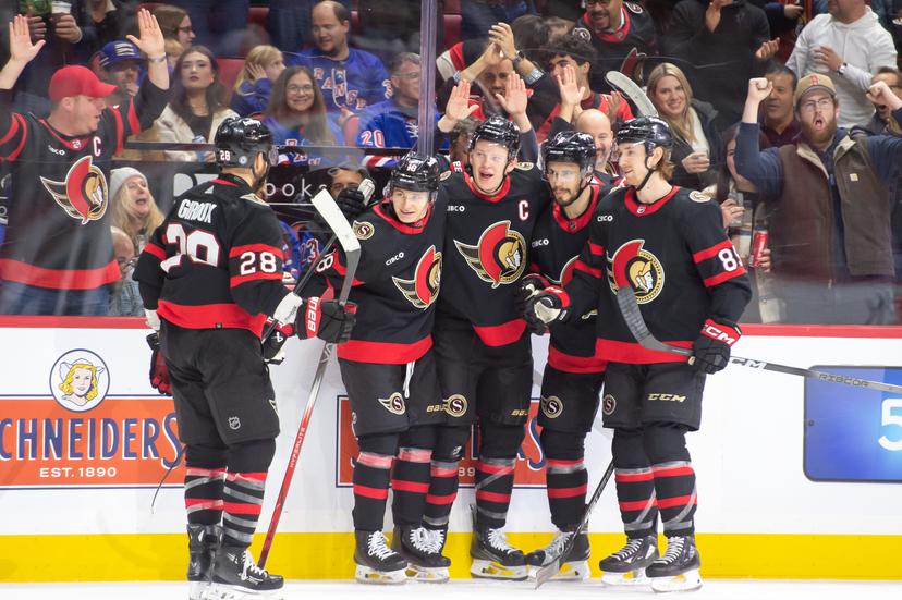 Senators player celebrate