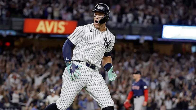New York Yankees slugger Aaron Judge is pictured celebrating a big hit. Judge sits atop the 2025 MLB home run leader odds entering the season.