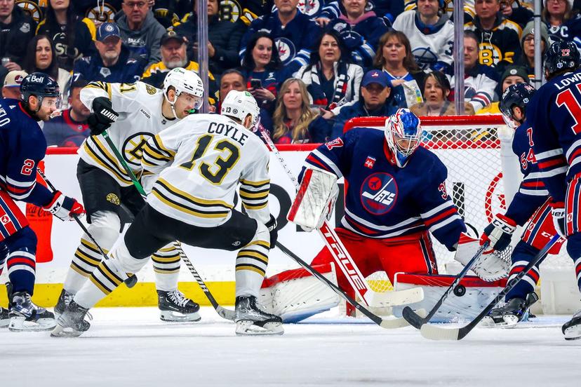 Charlie Coyle and Connor Hellebuyck