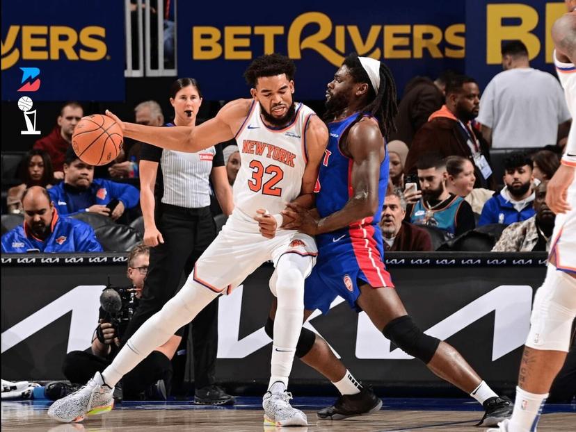 Karl-Anthony Towns tries to backdown Isaiah Stewart.