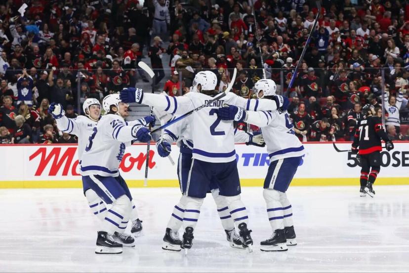 Toronto Maple Leafs players celebrating from a big win
