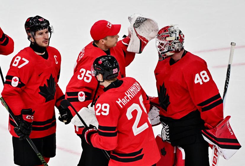 Nathan MacKinnon, Sidney Crosby and Logan Thompson