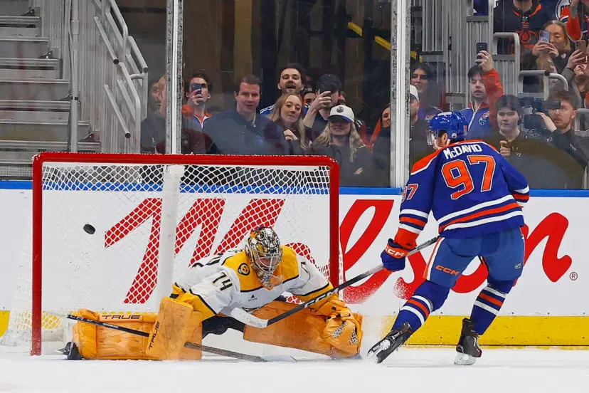 Connor McDavis and Juuse Saros
